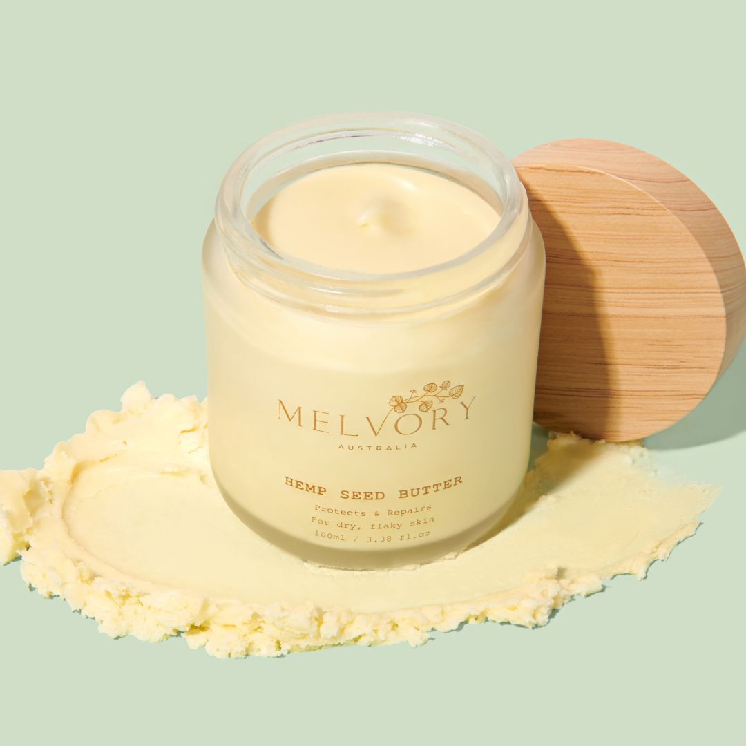 Jar of Melvory hemp seed butter with a wooden lid on a light green background