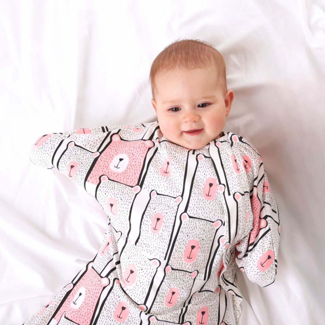 Swaddle transitioning sleep sack designed for safe rolling