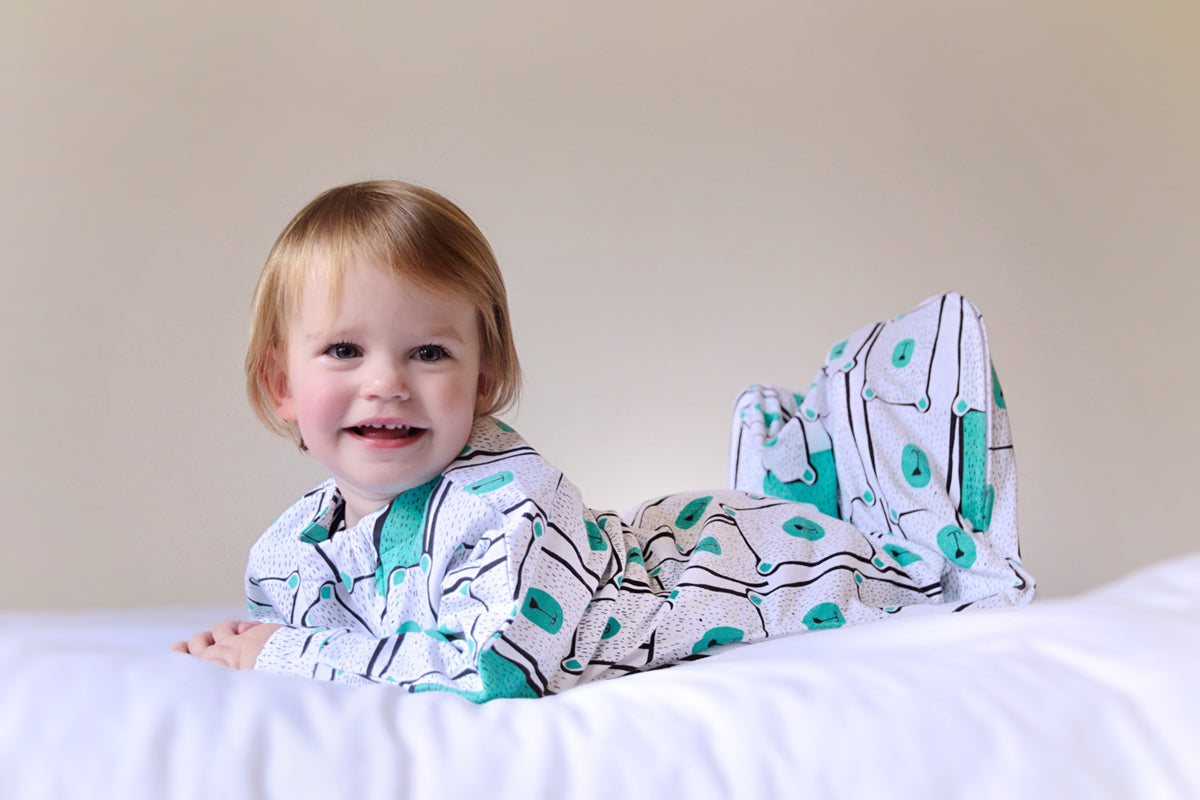 Baby sleep bag with arms for tummy rollers