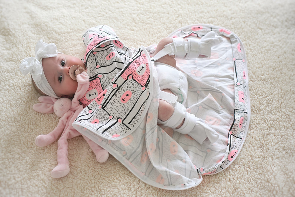 Baby with Hip Dysplasia wearing a hip harness brace