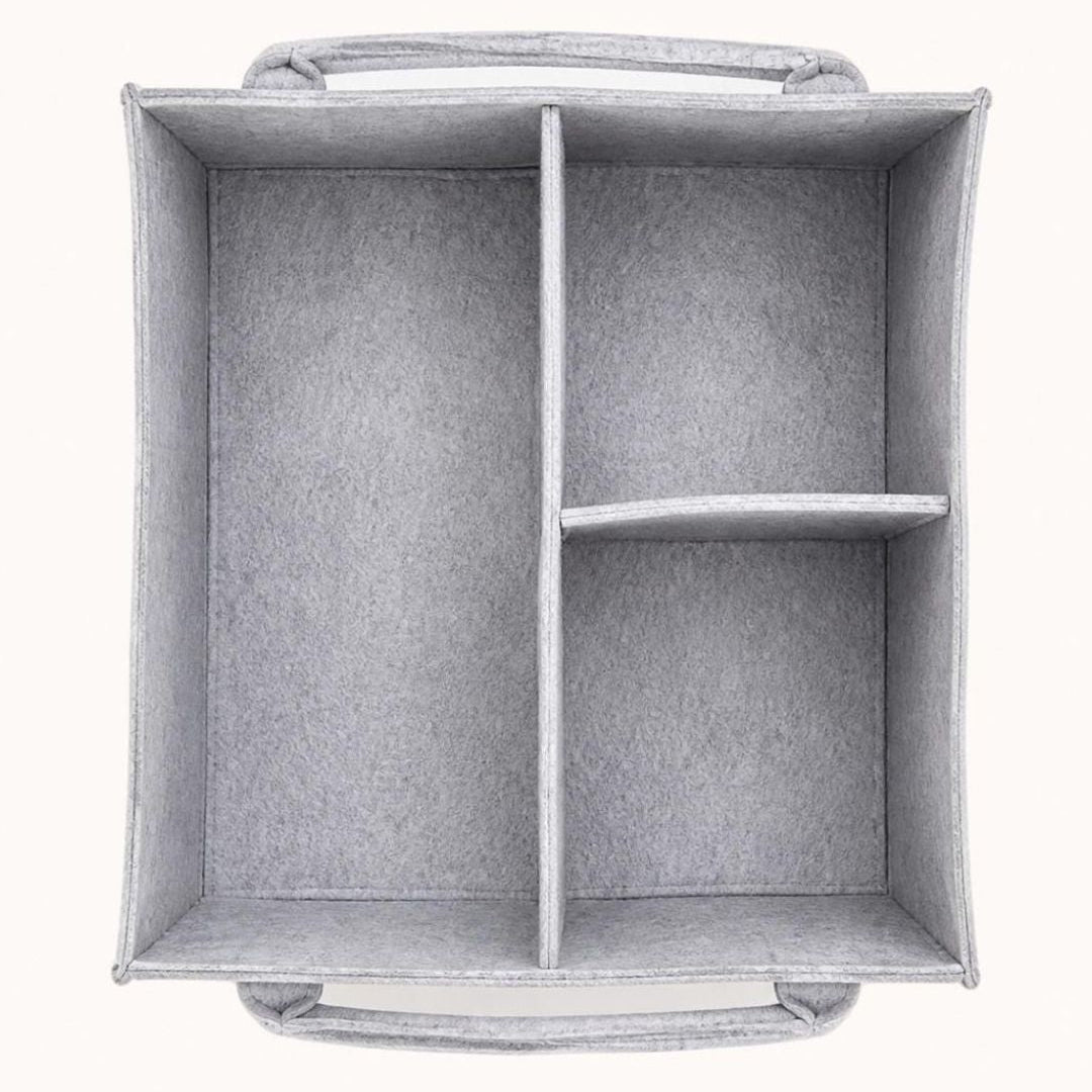 Light gray felt baby nappy caddy with flexible compartments and multiple front pockets