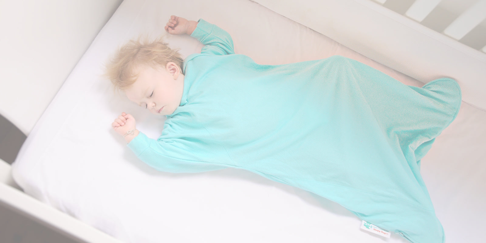 Baby sleeping bag that helps babies transition from swaddling to free arms when babies start rolling