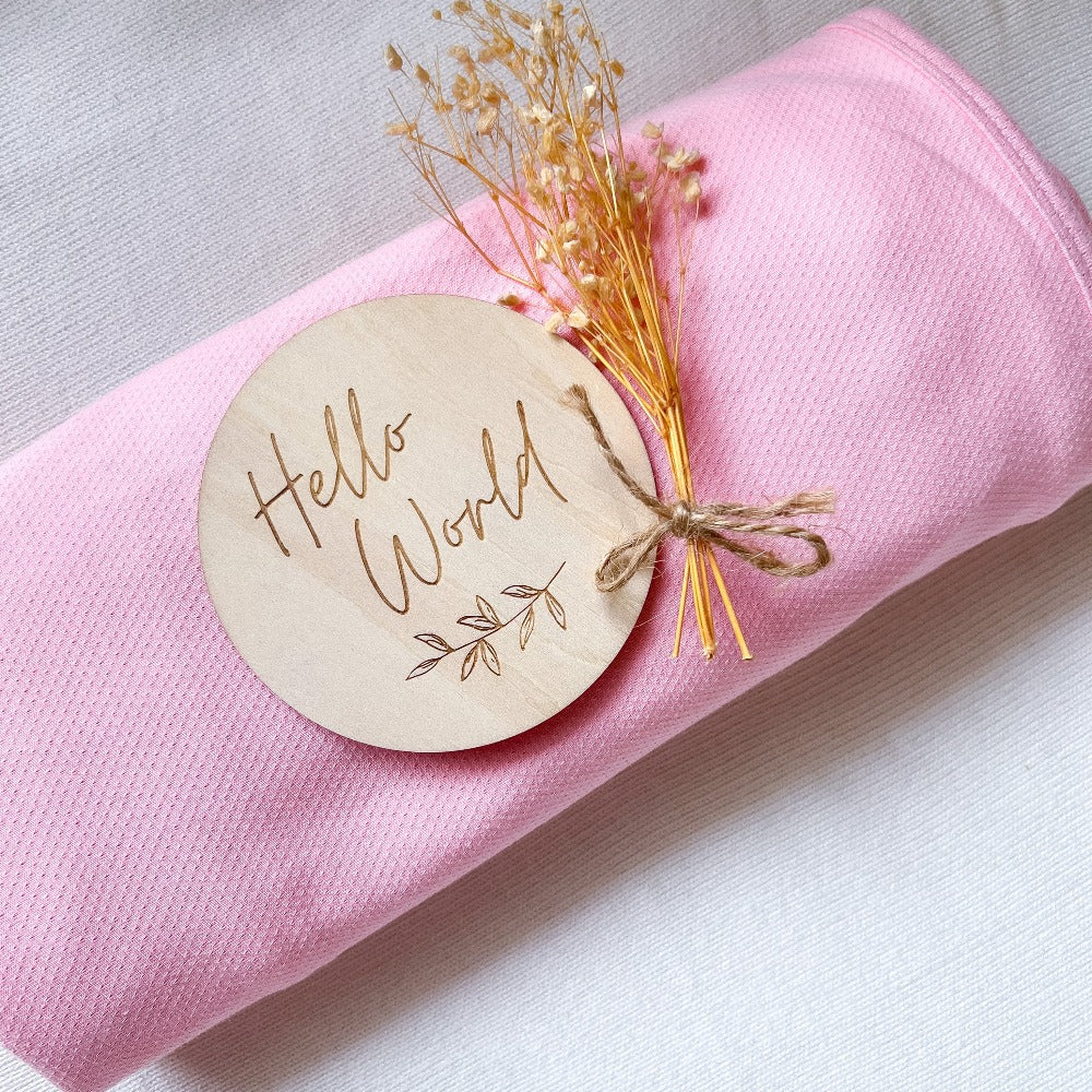 Koala Hugs newborn swaddle wrap gently cocoons baby's arms to help calm the startle reflex.