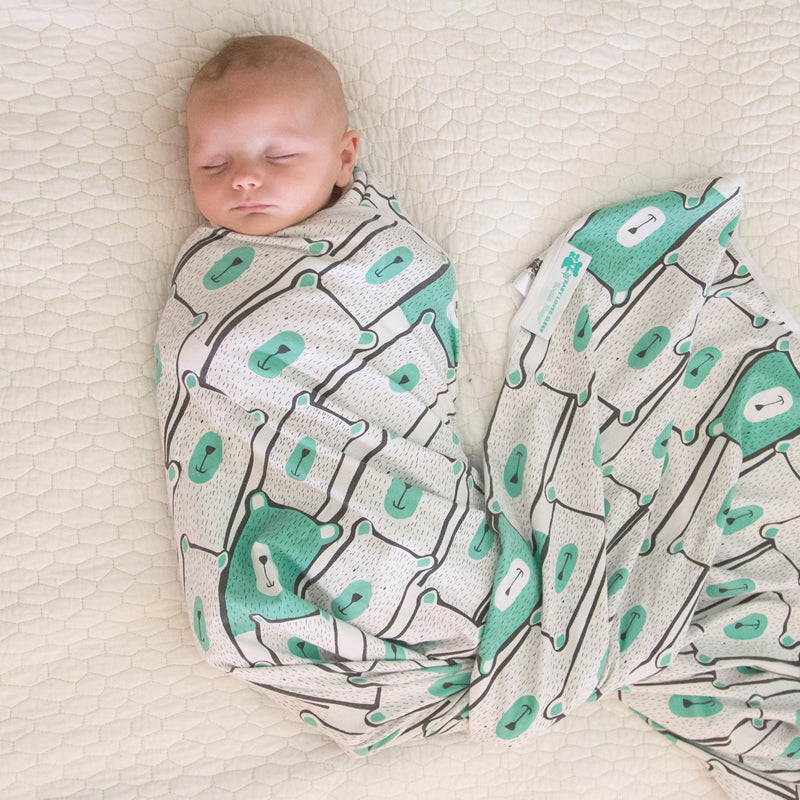 Newborn swaddle blanket wrap with arm pockets gives babies security to help calm the startle reflex.