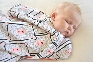 Sleepy Hugs sleep sack for gentle swaddle transitioning to free arms, calms the startle reflex, perfect for tummy rollers
